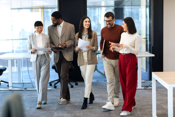 istock Business team walking in the office 2204220675
