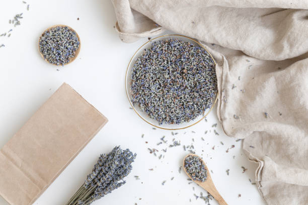 istock Lavender product presentation. Lavender flowers on a white background. Top view concept. 2204220994