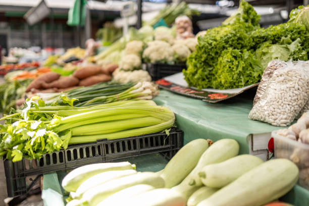 istock Fresh vegetables displayed at a farmers market stall 2204221219