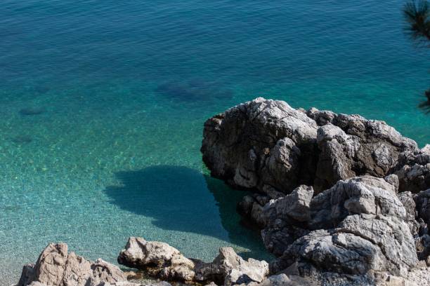 istock Rocky coastline with clear turquoise water 2204222297