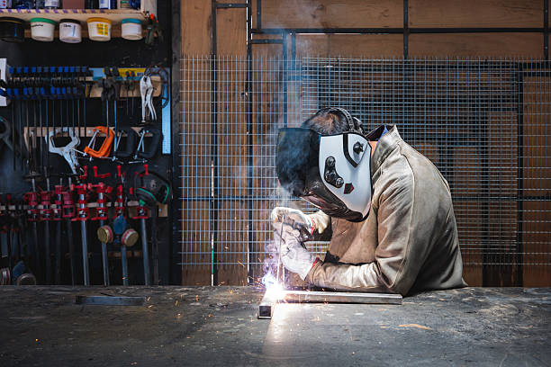 grinding in his workshop.
