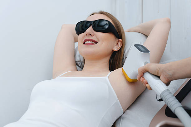 istock young woman on laser epilation procedure 2204226664