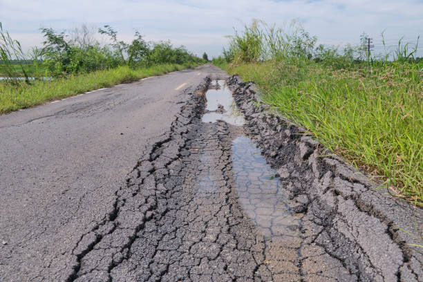 istock Asphalt surface on the street was demolished due to poor construction. 2204227768