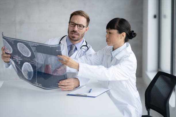 istock Medical Consultation Between Two Doctors with X-Rays Views 2204227802