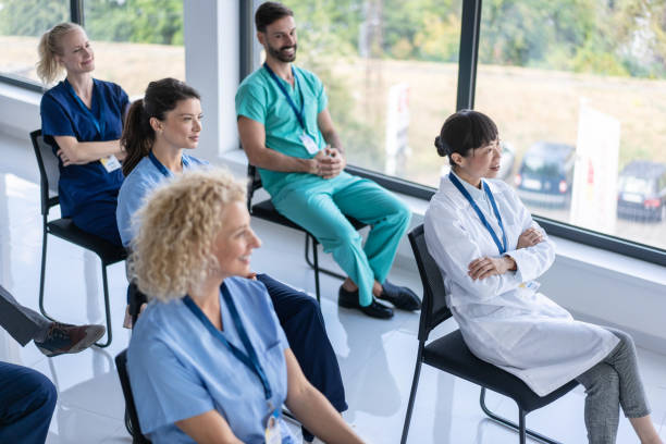 istock Healthcare team members in deep discussion at workplace 2204227819
