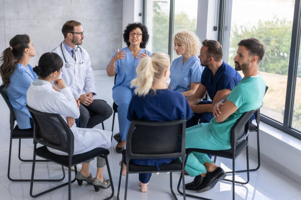 istock Medical Team Engaged In Serious Conversation And Insights 2204227825