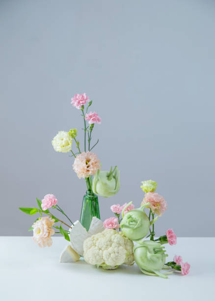 istock unusual composition of flowers, vegetables and cheese 2204227921