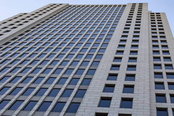 istock Tall modern concrete building with windows 2204228615