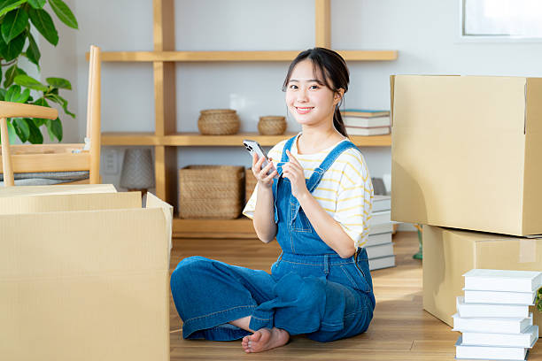 istock Young woman preparing to move 2204229532