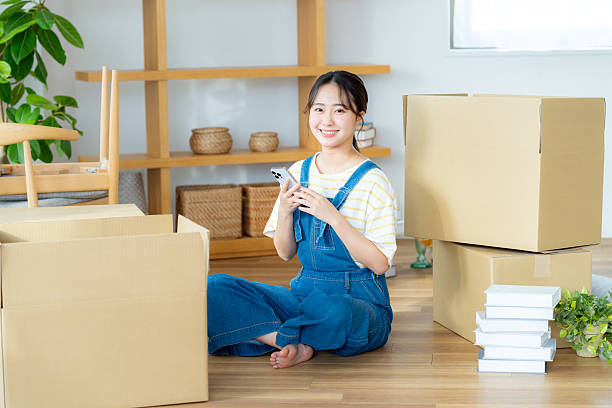 istock Young woman preparing to move 2204229534