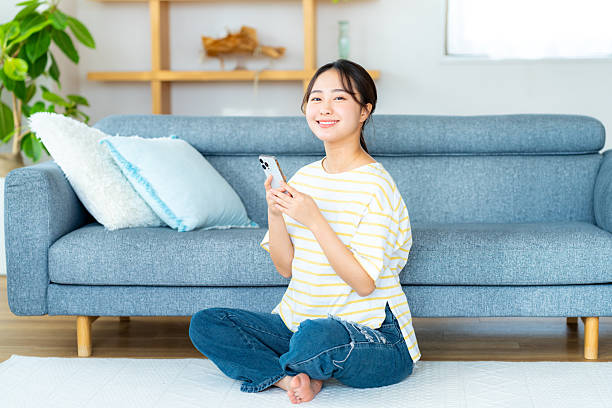 istock young woman calling on smartphone 2204229601