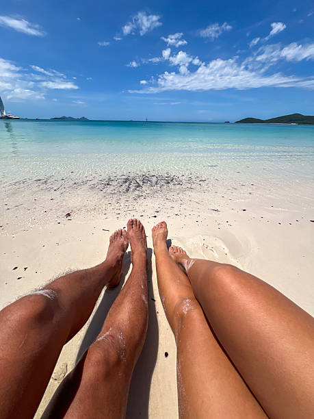 istock Relaxing on Tropical Beach with Crystal Clear Waters 2204231943