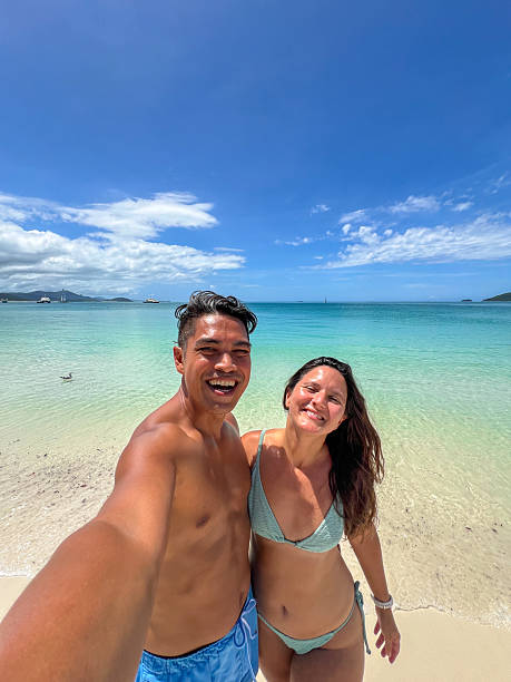 istock Couple Taking a Selfie on a Tropical Beach 2204232133