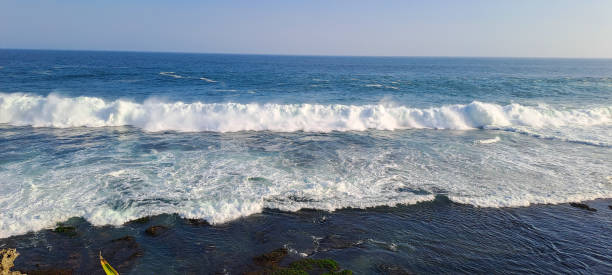 istock Aerial top down view of rough ocean waves with foam 2204232967