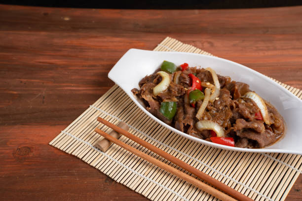 istock Asian Food: Teriyaki Beef with Onions and Peppers. 2204234412