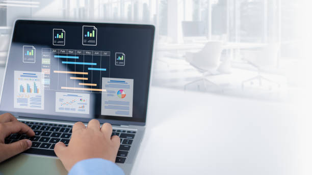 istock Project management tool and work schedule concept, Businessman use laptop to manager working projects and update task with gantt chart schedule to Business plan and progress, Planning software. 2204237471