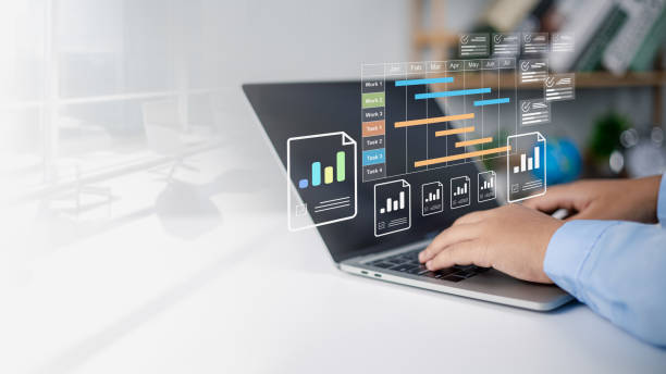 istock Planning software, Project management tool and work schedule concept, Businessman use laptop to manager working projects and update task with gantt chart schedule to Business plan and progress. 2204237479