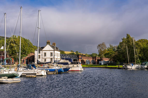 Bowling, West Dunbartonshire, Scotland, UK - September 18, 2023: Boats in Bowling Harbour, with the Bowline in the background