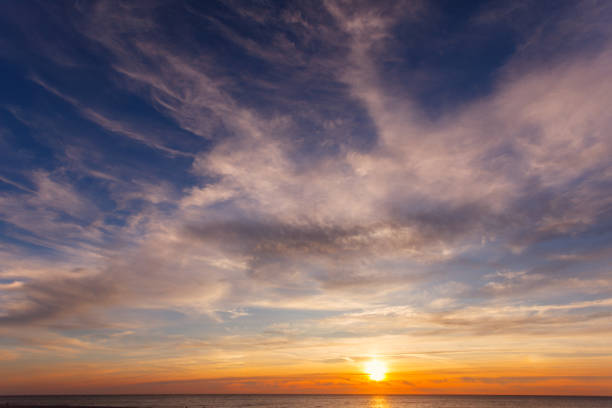 Beautiful, orange-pink sunset over the sea. Background image