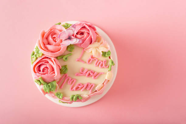 istock Delicate Pink Mother's Day Cake with Floral Decorations 2204244635