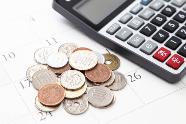 istock A calendar, some coins and a calculator. 2204244926