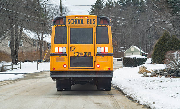 istock school bus in residential district after snow 2204245527