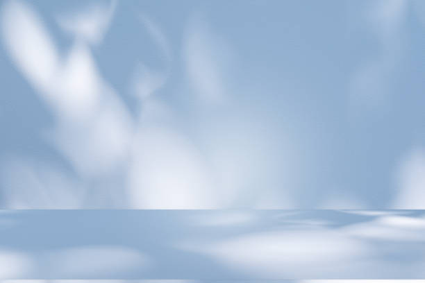 istock Studio style background wall decoration presentation uses white and blue tones. with shadows cast from a nearby window, concept creating a decorative 2204252510