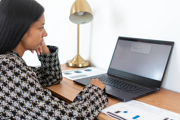 istock Woman working or studying at home 2204253083