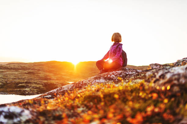 istock Meditation on lotus at sunset 2204259935