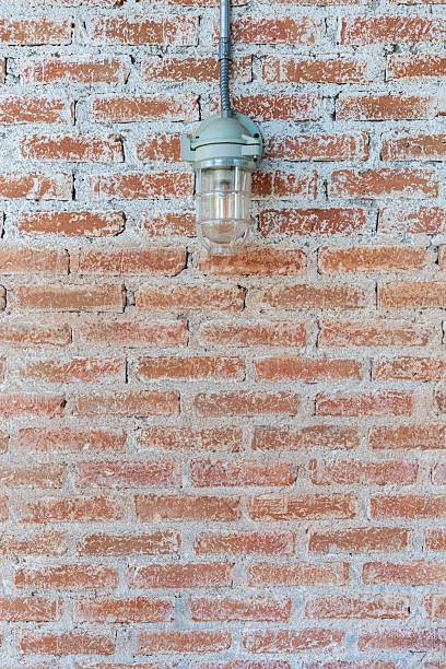 istock Close-up shot of a textured red brick wall with white mortar. 2204262914