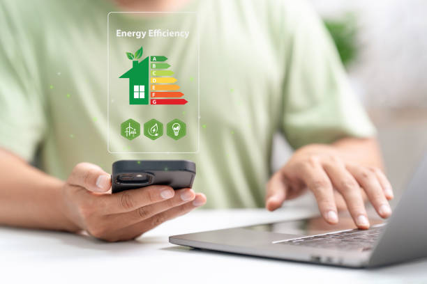 istock Energy efficiency rating and eco home renovation insulation performance concept. Energy efficiency mobile app on screen. Ecology, eco house and bioenergetic house, efficiency scale. 2204263086