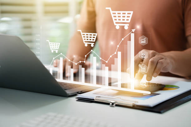 Businessman analyzing sales data, financial growth graph chart report and Using Calculator To Sum Up Shopping Cart Costs And Profits Growing In Total Sales For Online Store. Financial accounting. stock photo