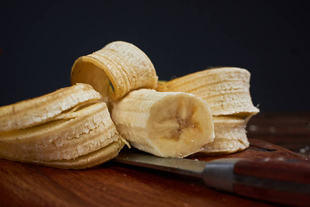 banana and knife on cutting board