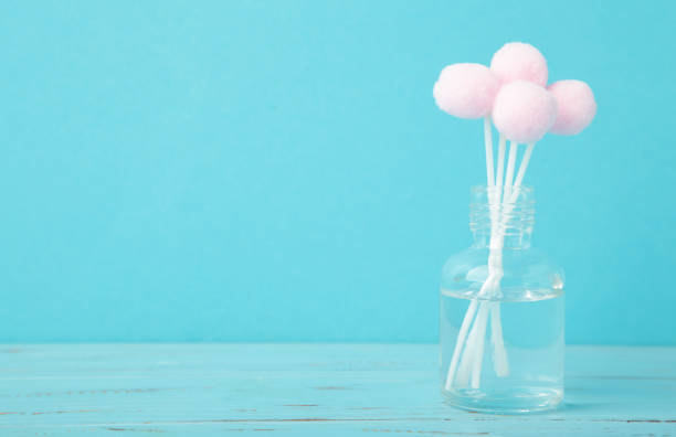 istock Air freshener on blue. White aroma diffuser bottle with sticks. Minimalism 2204263860