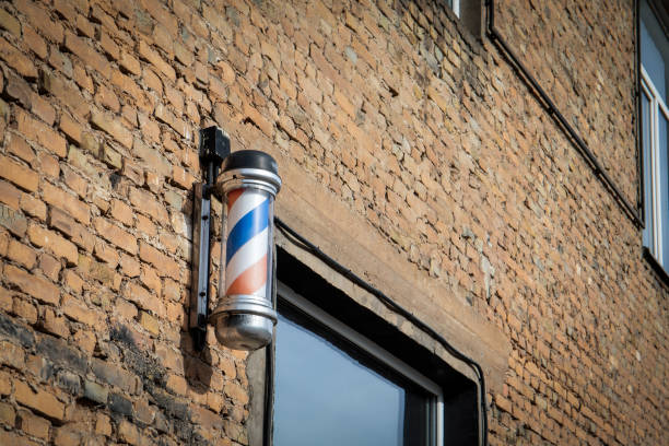 Classic Barber Shop Pole on Brick Wall.
