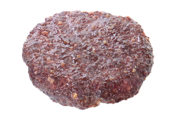 istock Tasty grilled burger patty isolated on white 2204265448