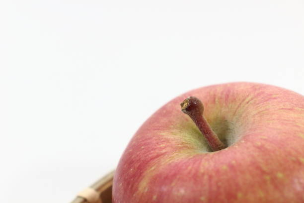 This is an image of an apple, a taste of autumn. The ripe apple, packed with honey, spreads sweet and sour juice in your mouth.
