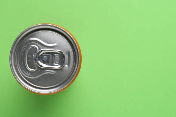 istock Energy drink in can on green background, top view. Space for text 2204267466