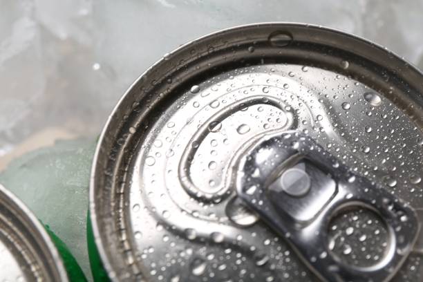 istock Energy drinks in wet cans and ice cubes, closeup 2204267499