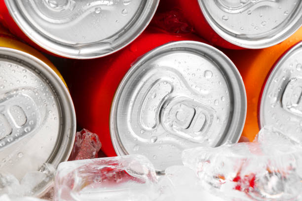 istock Energy drinks in wet cans and ice cubes, closeup 2204267652