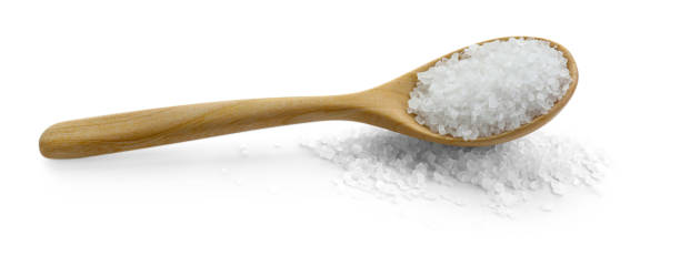istock Natural salt in wooden spoon isolated on white 2204268690