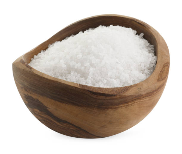 istock Natural salt in wooden bowl isolated on white 2204268718