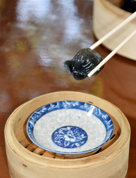 istock Black chinese Ha kao (dim sum) with chopsticks, Close up shot 2204269733