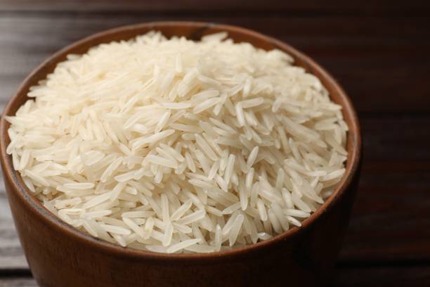 istock Raw basmati rice in bowl on table, closeup 2204270506
