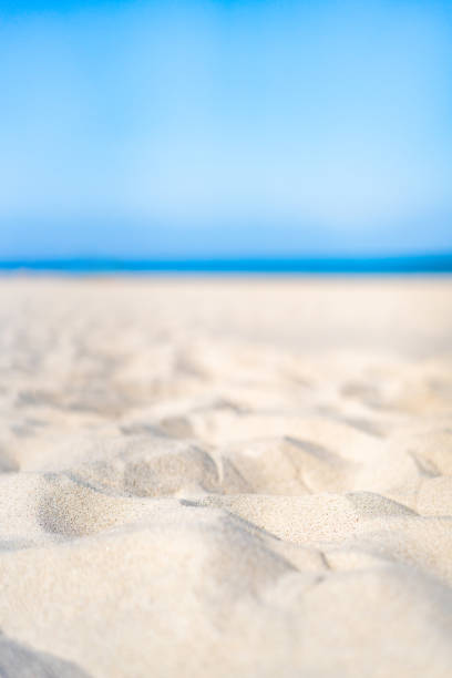 istock Empty white sandy beach. Close-up for white sand, focus on foreground 2204273196