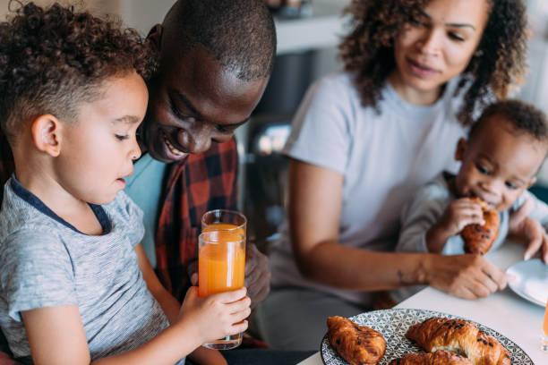 istock Happy family having breakfast at home. 2204274614