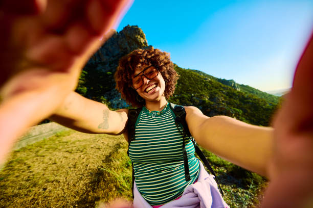 istock Gen Z female hiker taking a selfie while hiking in the mountains 2204276601
