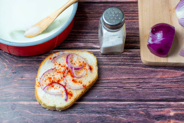 Hungarian traditional food - bread with lard, and red paprika, onion