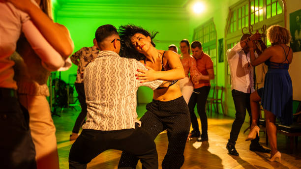 istock Joyful Caucasian Couple Dancing in Vibrant Studio Party 2204281935