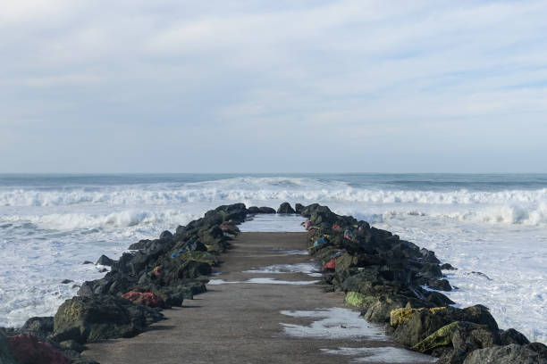 Colorful paint on rocks that protect a sea wall in Anglet in the Atlantic Ocean
